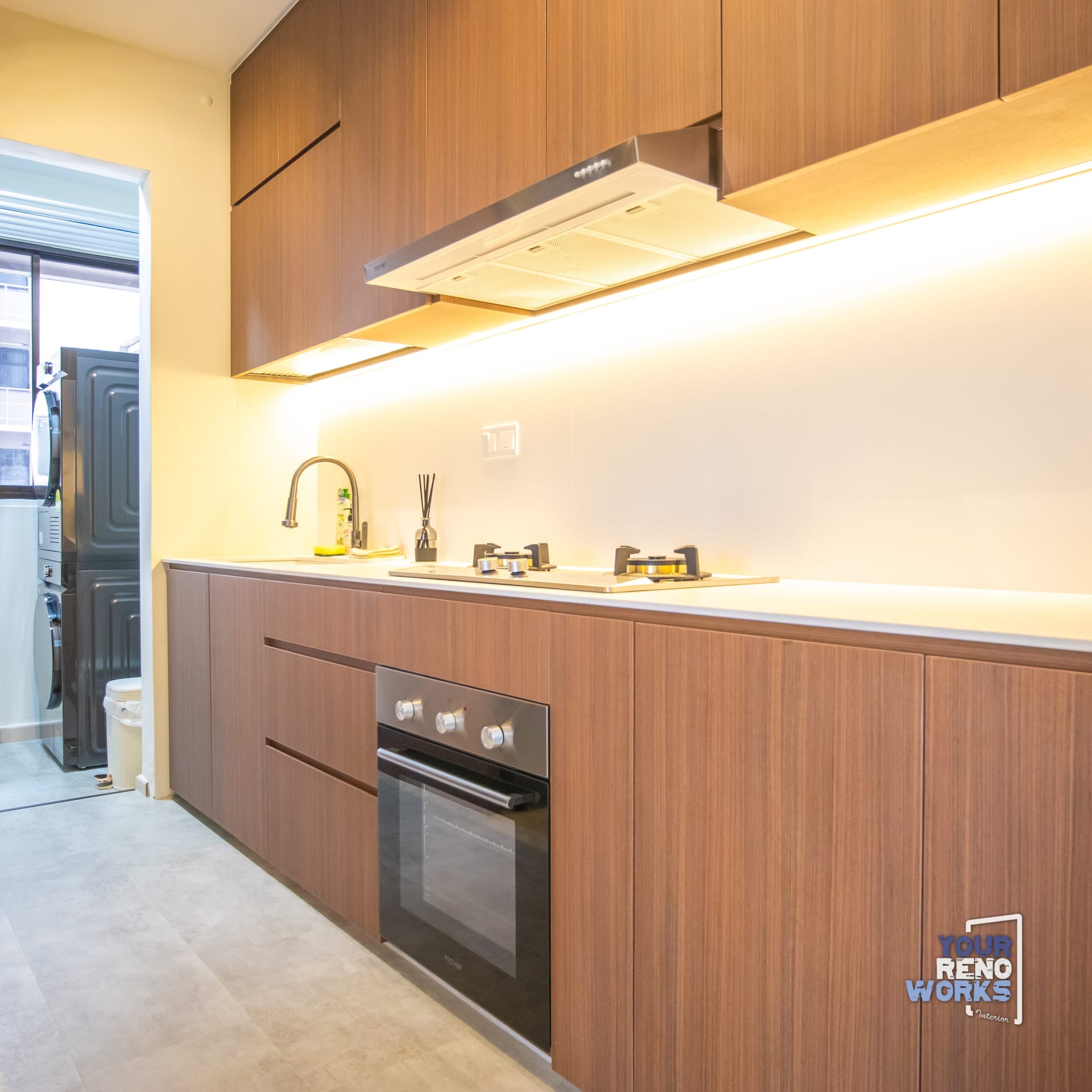 Sophisticated modern dark haven interior with charcoal cabinetry and ambient lighting